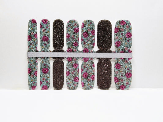 Set of floral and black patterned nail wraps against a white background