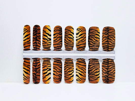 Set of nail wraps with tiger stripe pattern on a white background