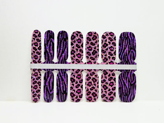 Set of nail wraps with purple and pink zebra and leopard print designs on a white background