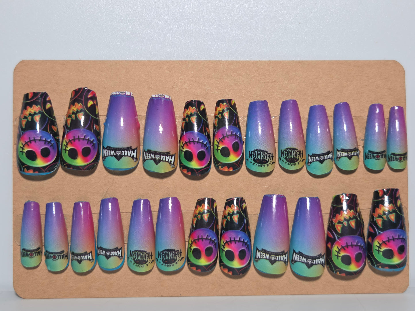 Set of colorful nail wrap designs on a piece cardboard