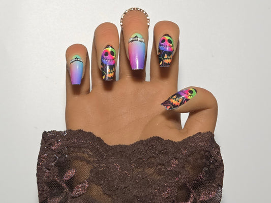 Hand with colorful nail wrap on a hand. White background